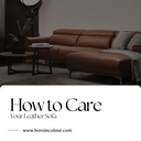 Modern brown leather sofa in a stylish living room setting with cushions and throw blanket