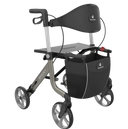 A modern rollator walker with a black padded backrest, black tray table, and a large black storage basket on a silver frame, shown against a plain white background.