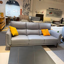 Gray sofa with yellow cushions in a room setting