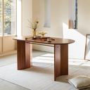 Born in Colour wooden oval dining table with sturdy legs in bright minimalist room