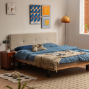Modern beige upholstered bedframe with wooden base and blue bedding in stylish bedroom