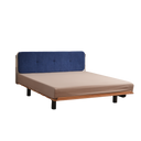 Born in Colour modern bedframe with a wooden base and navy blue upholstered headboard