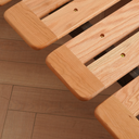 Close-up of Born in Colour wooden bedframe slats showing smooth finish and sturdy construction