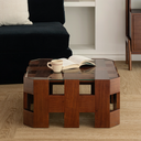 Born in Colour wooden sofa table with glass top in stylish geometric design next to black sofa