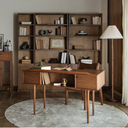 Elegant wooden Born in Colour study desk with drawers in a cosy home office setting