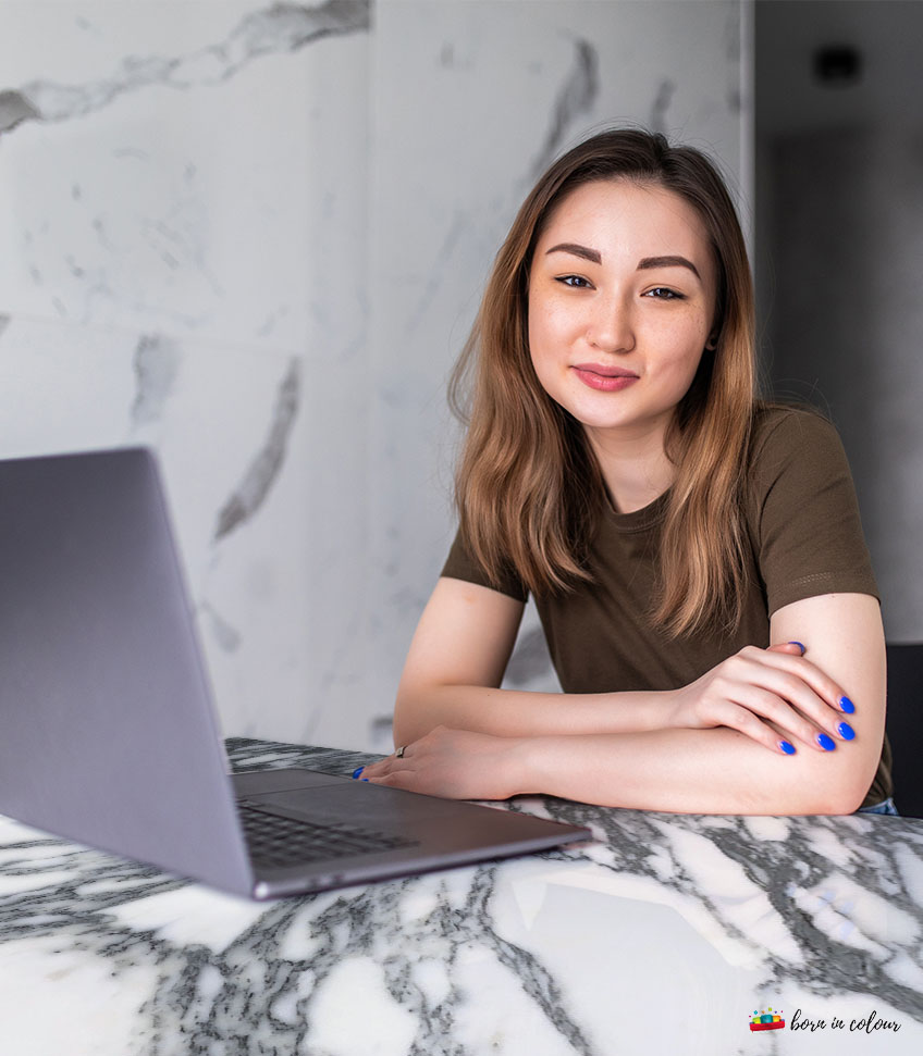 A Girl working on a dining table